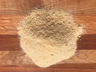 Middle Maples Farm Organic Maple Sugar, piled on a cutting board